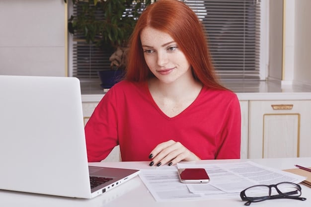 A person is using a laptop to file their taxes online. The screen shows tax preparation software, with fields relating to the Child Tax Credit highlighted. The surrounding environment is a modern, organized home office.