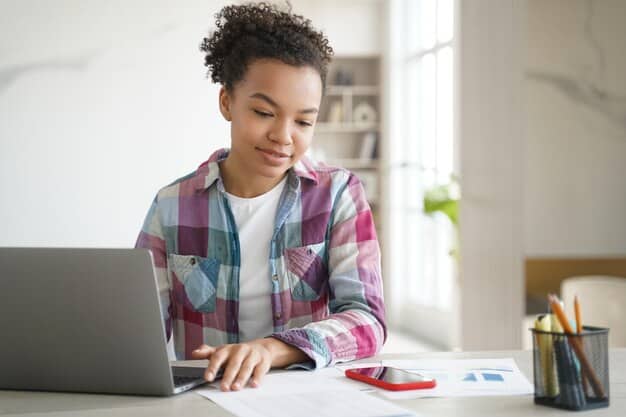 A student using a financial aid calculator on a laptop, illustrating the process of estimating financial aid eligibility.