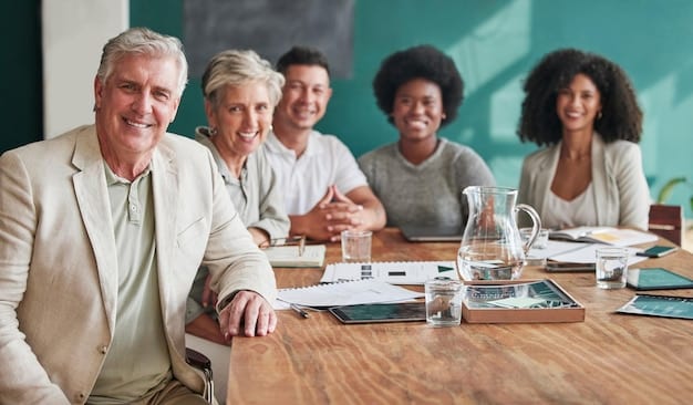 A diverse group of people attending a retirement planning seminar, with a financial advisor presenting information on savings and investments.