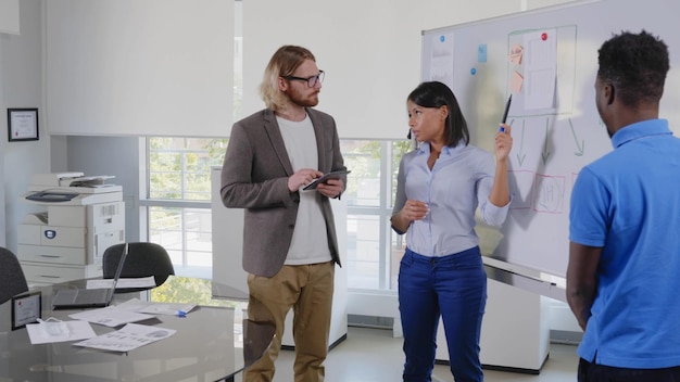 An employee presenting a well-researched proposal to their manager, with graphs and charts displayed on a screen in the background. The manager looks attentive and engaged.