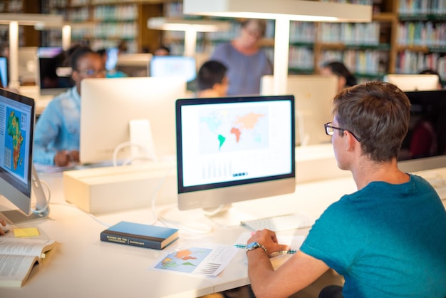 A student using a laptop to research colleges online, with various college websites and data displayed on the screen, highlighting the importance of thorough research.